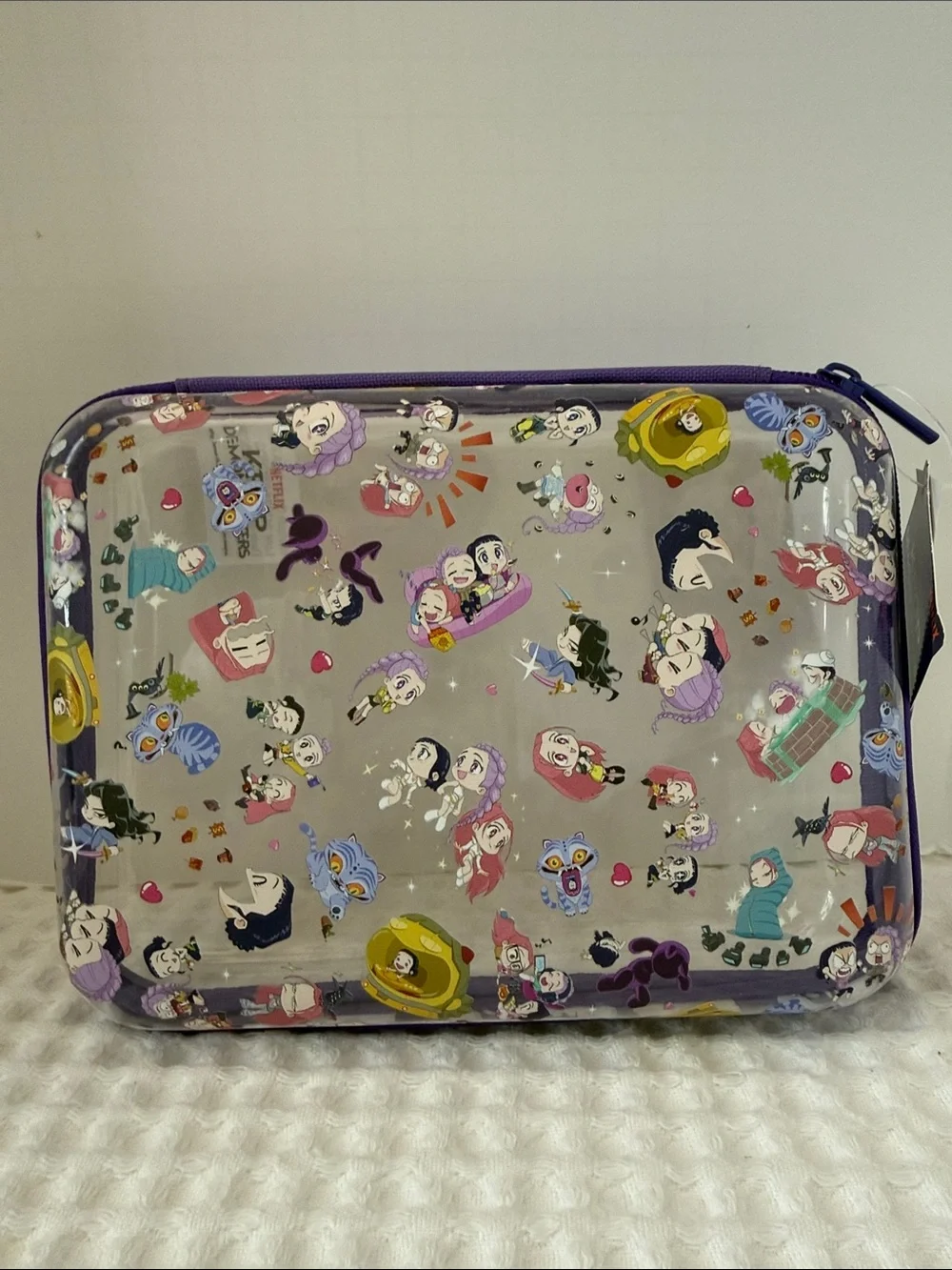 Netflix K-POP Demon Hunters Chibi-Style Clear PVC Pencil Case with Purple Trim.
